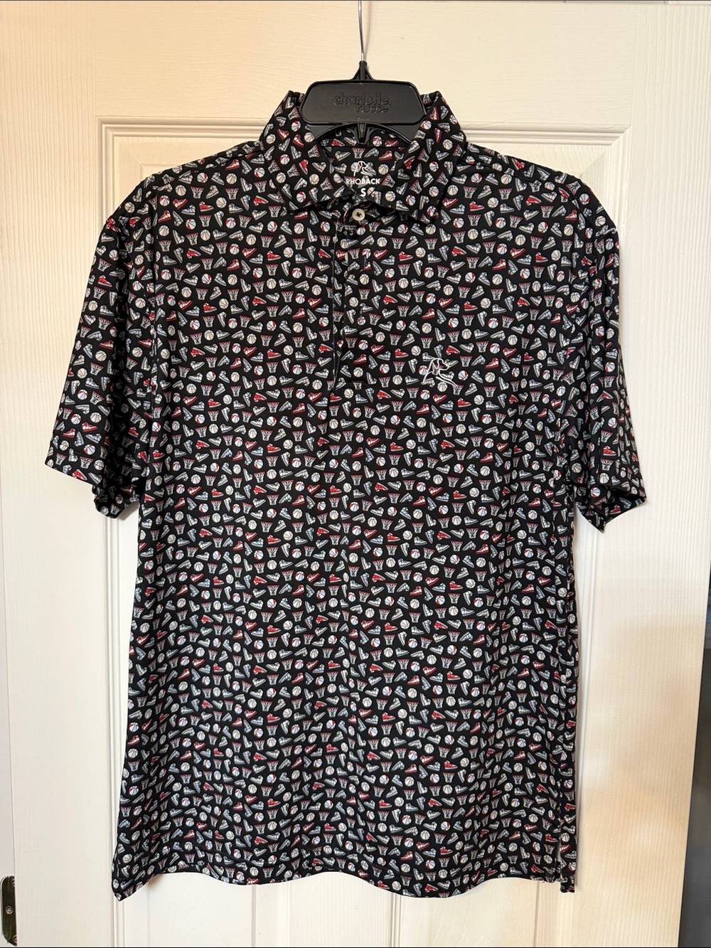 Rhoback Black Polo. Sneakers and basketballs